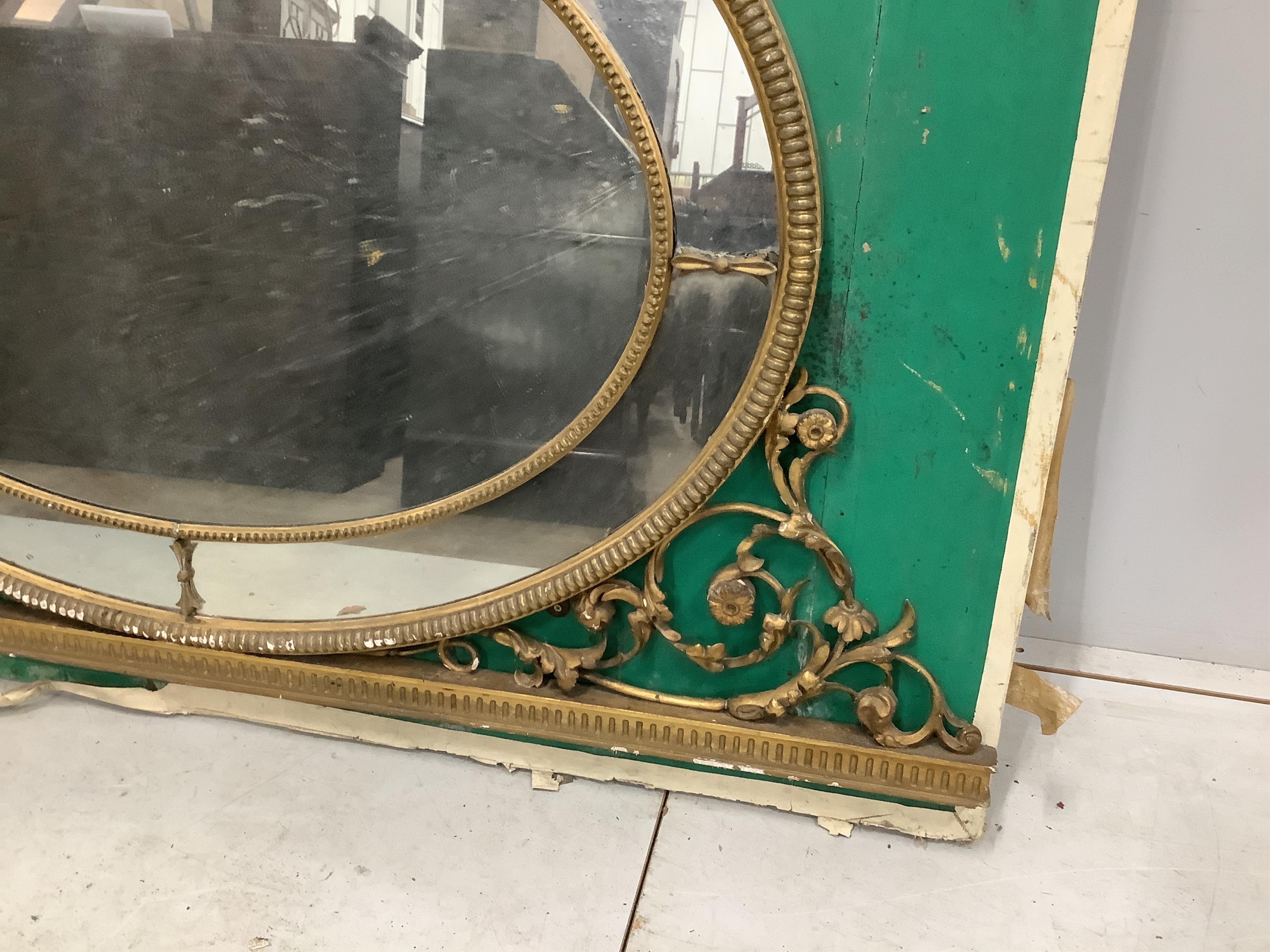 A Victorian oval giltwood and composition wall mirror, width 152cm, height 157cm. Condition - poor to fair